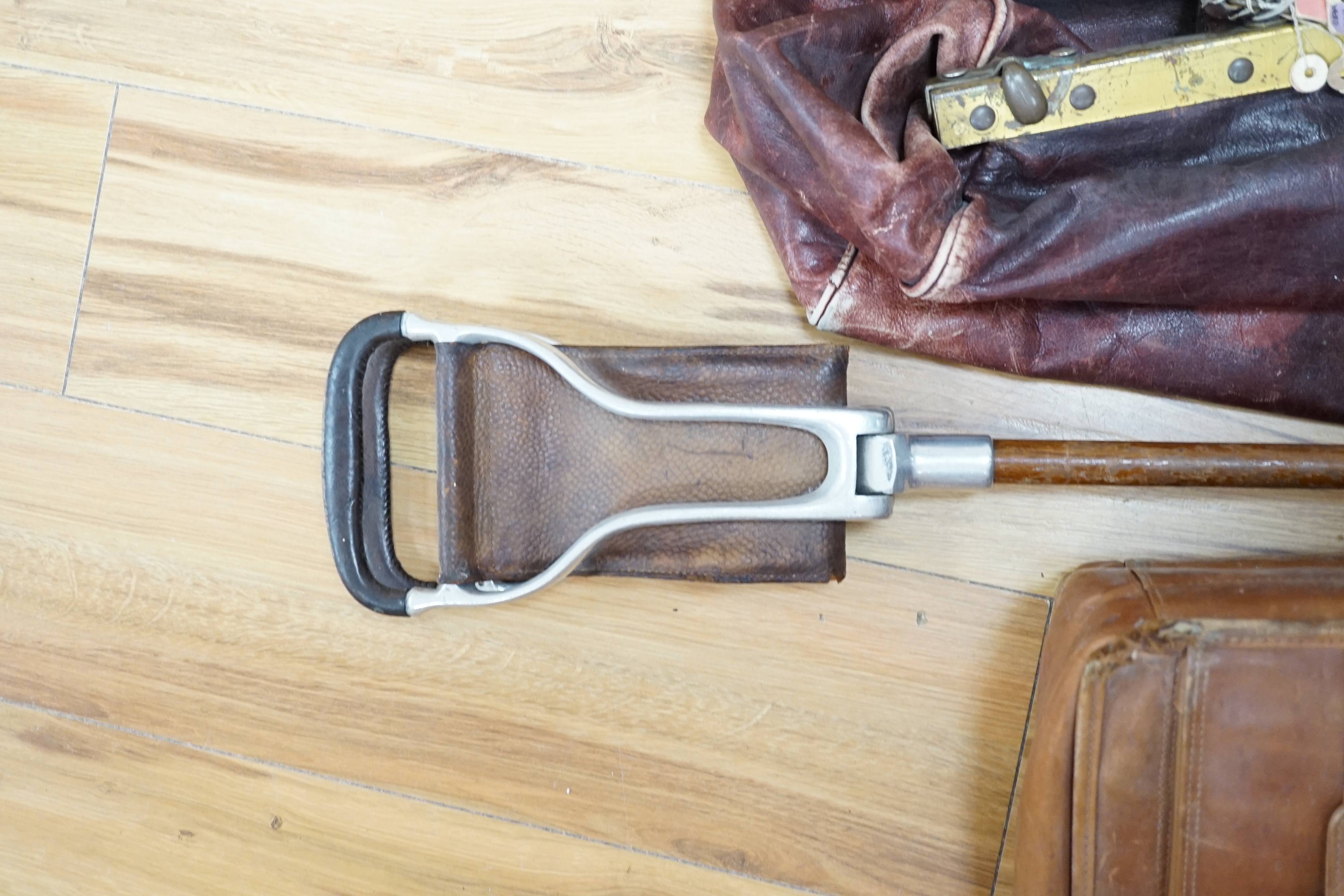 A leather Gladstone bag, an attaché case and a shooting stick